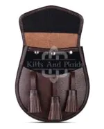 Made from 100% genuine brown leather Classic plain-front design for everyday wear Secure snap-button flap closure Adjustable leather waist strap with chrome chain Spacious interior fits wallet, phone, keys, etc.